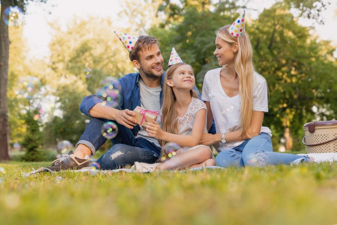 Family celebrating baby's first birthday with joy and love.